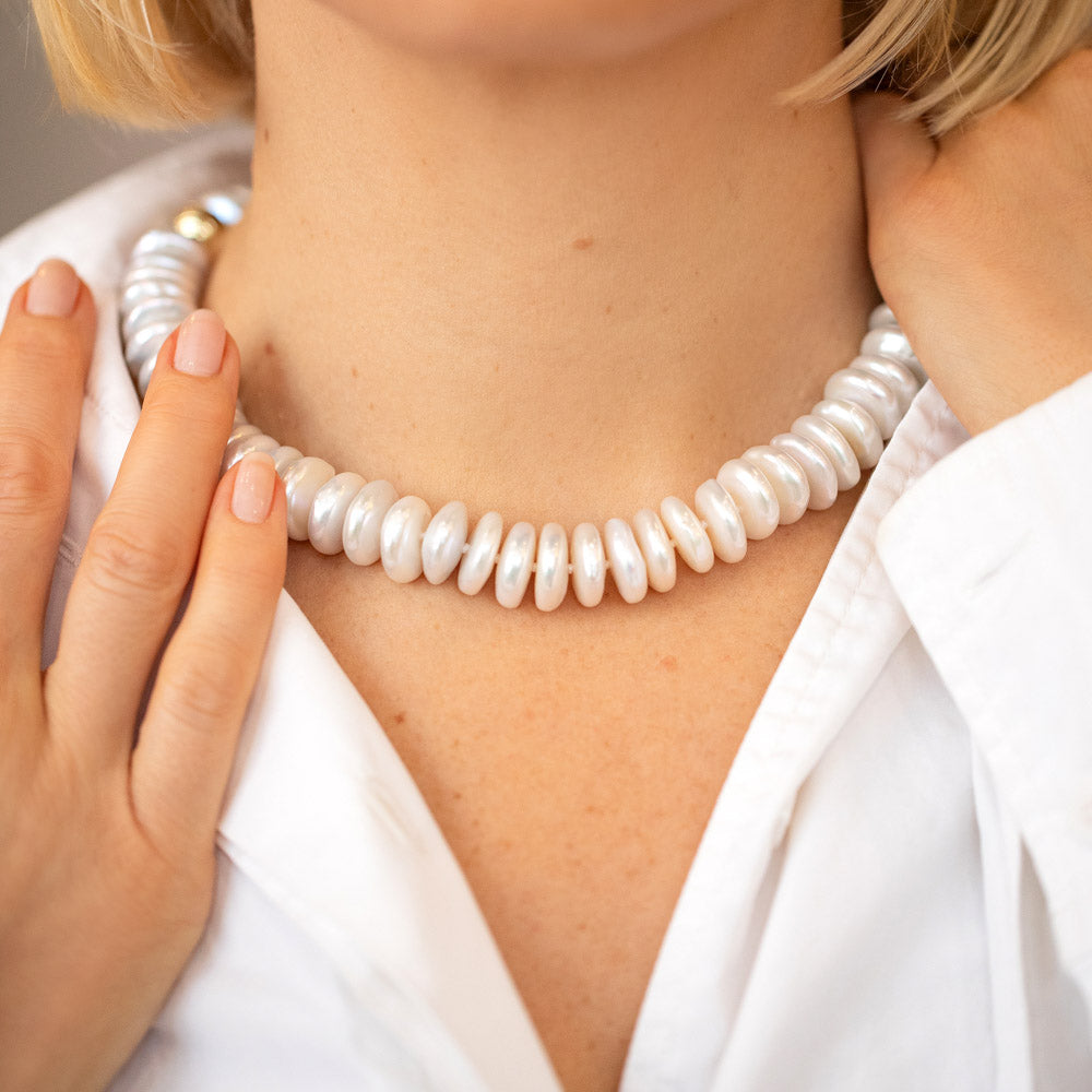 product_details::Snow Cap Pearl Necklace on model.