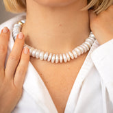 product_details::Snow Cap Pearl Necklace on model.
