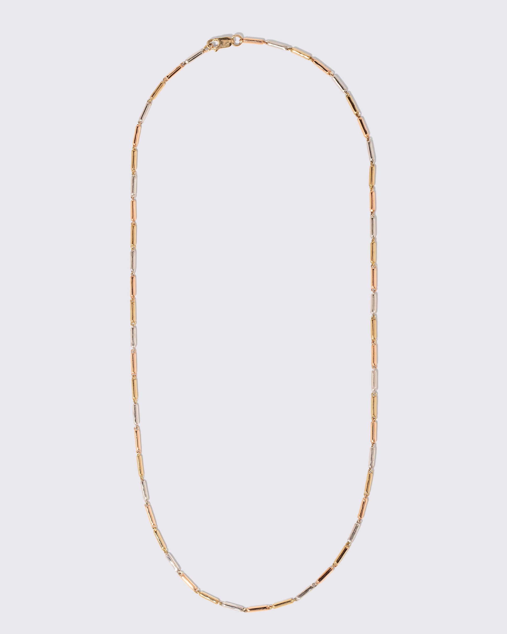 Tricolor Butter Chain Necklace on light color background.