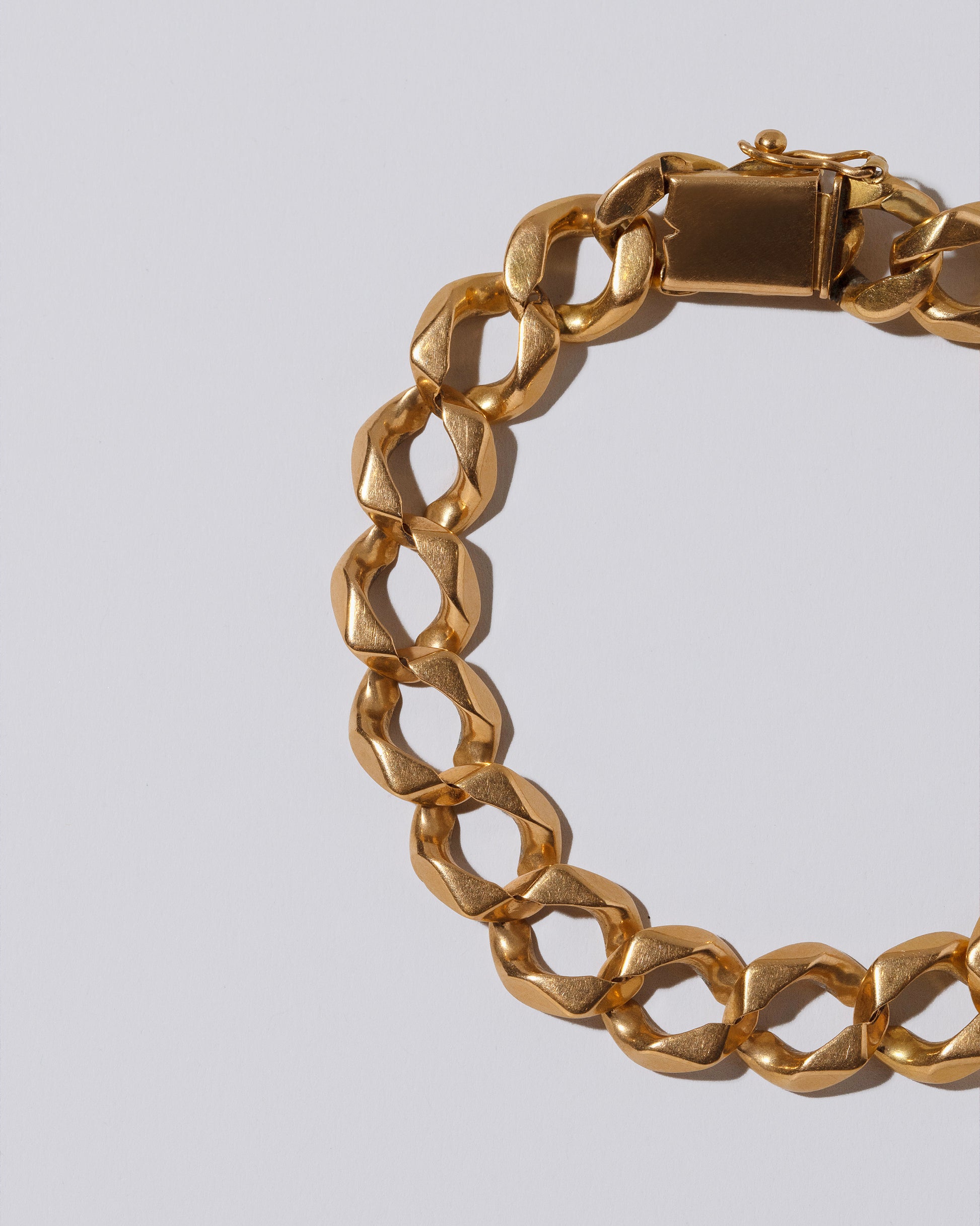 Curb Chain Bracelet on light color background.