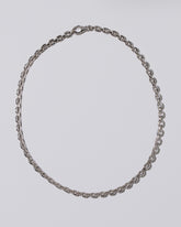 Cartier Oval Cable Chain Necklace on light color background.