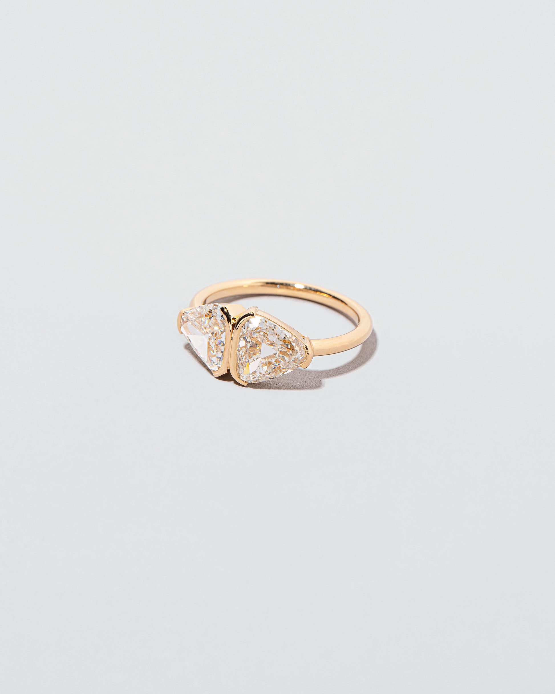 View from the side of the First & Last Ring on light color background.