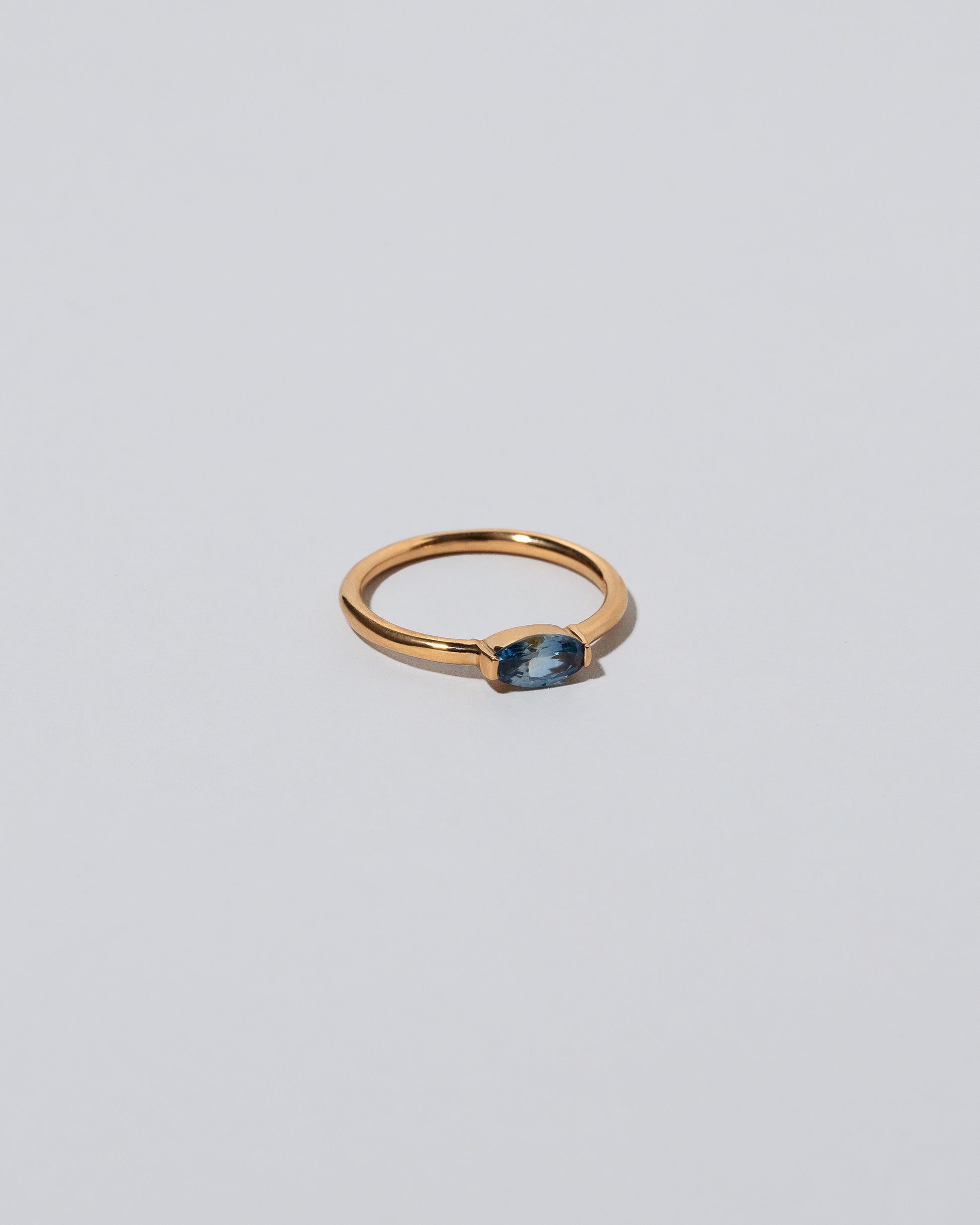 Blue Devant Ring on light color background.