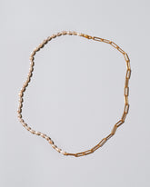 Rice Pearl Long Oval Necklace on light color background.