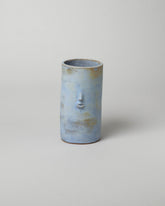Rami Kim Frost Blue Face Vase on light color background.