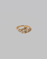 Champagne Diamond Luna Ring on light color background.