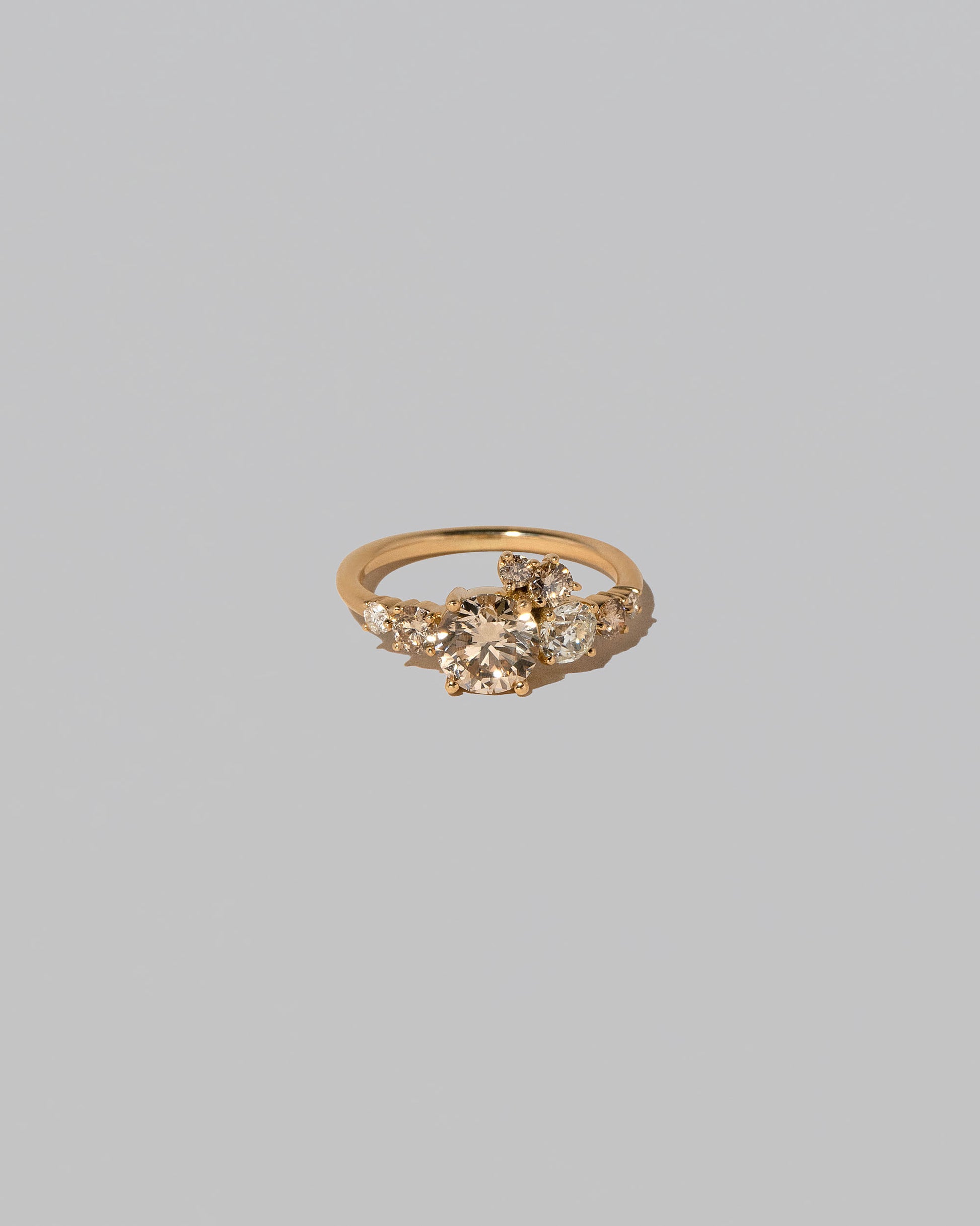 Champagne Diamond Luna Ring on light color background.