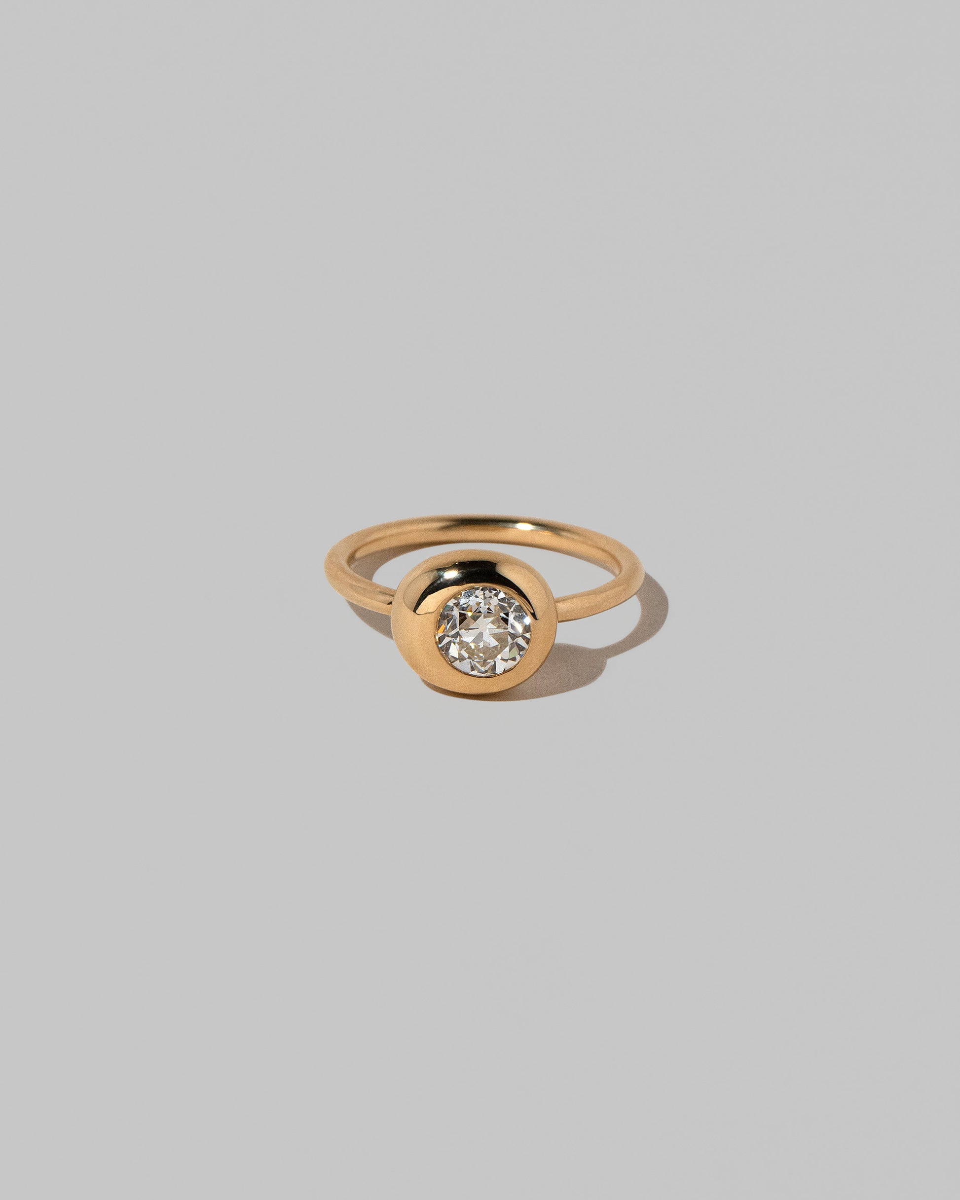 Diamond Grand Level Ring on light color background.