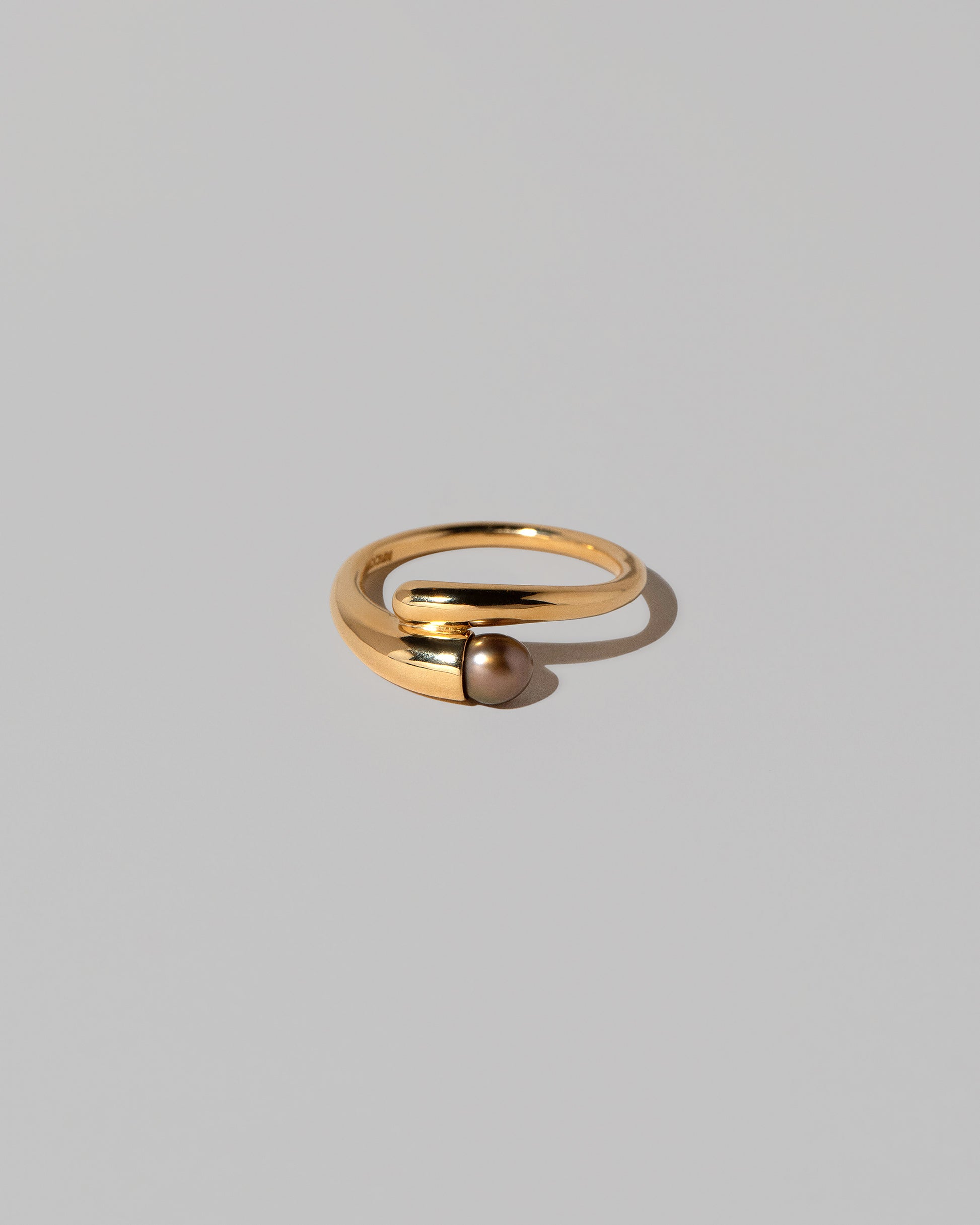 Tethys Ring on light color background.