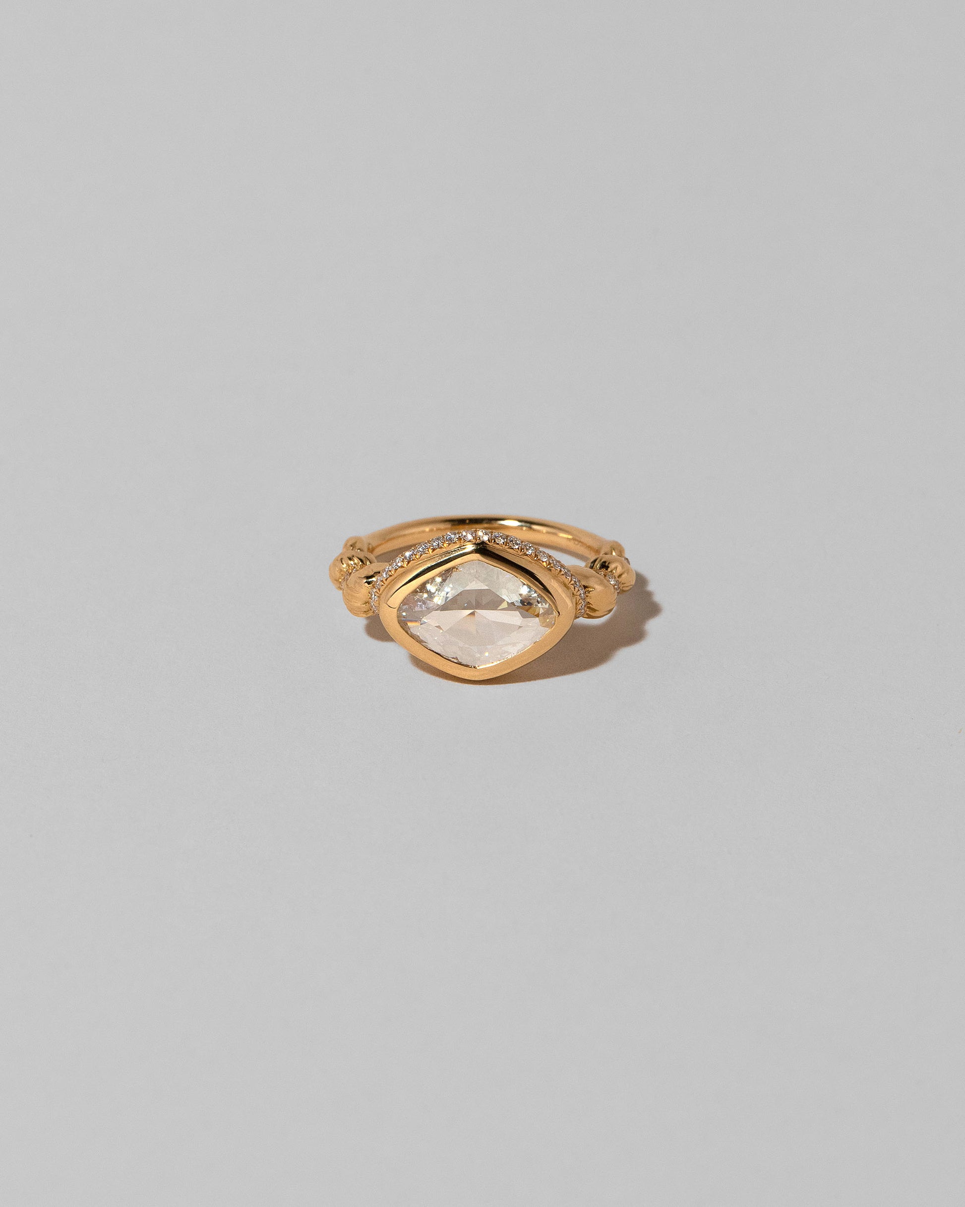 Twist Ring on light color background.
