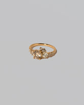 View from the side of the Champagne Diamond Luna Ring on light color background.