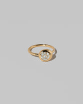 View from the side of the Step Cut Diamond Grand Level Ring on light color background.