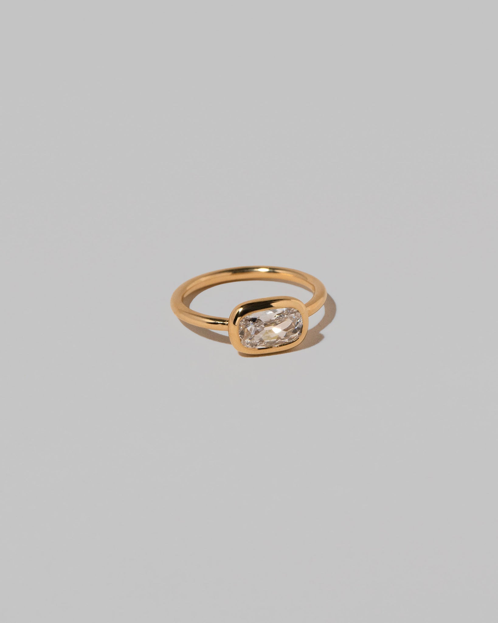 View from the side of the Gusher Diamond Ring 017 on light color background.