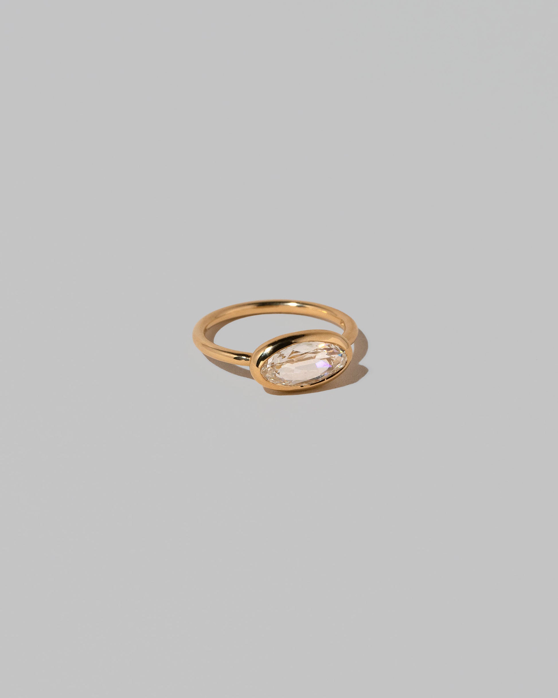 View from the side of the Gusher Diamond Ring 019 on light color background.