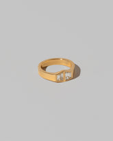 View from the side of the Miroir Ring on light color background.