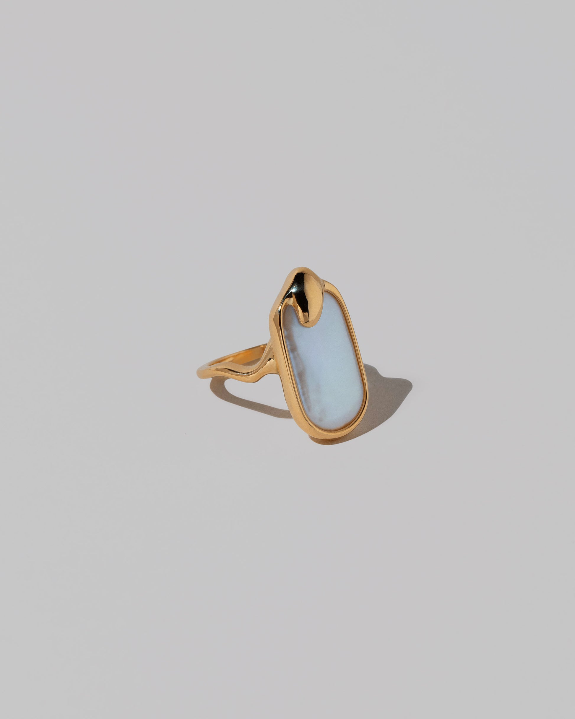 View from the side of the Oceanus Ring on light color background.