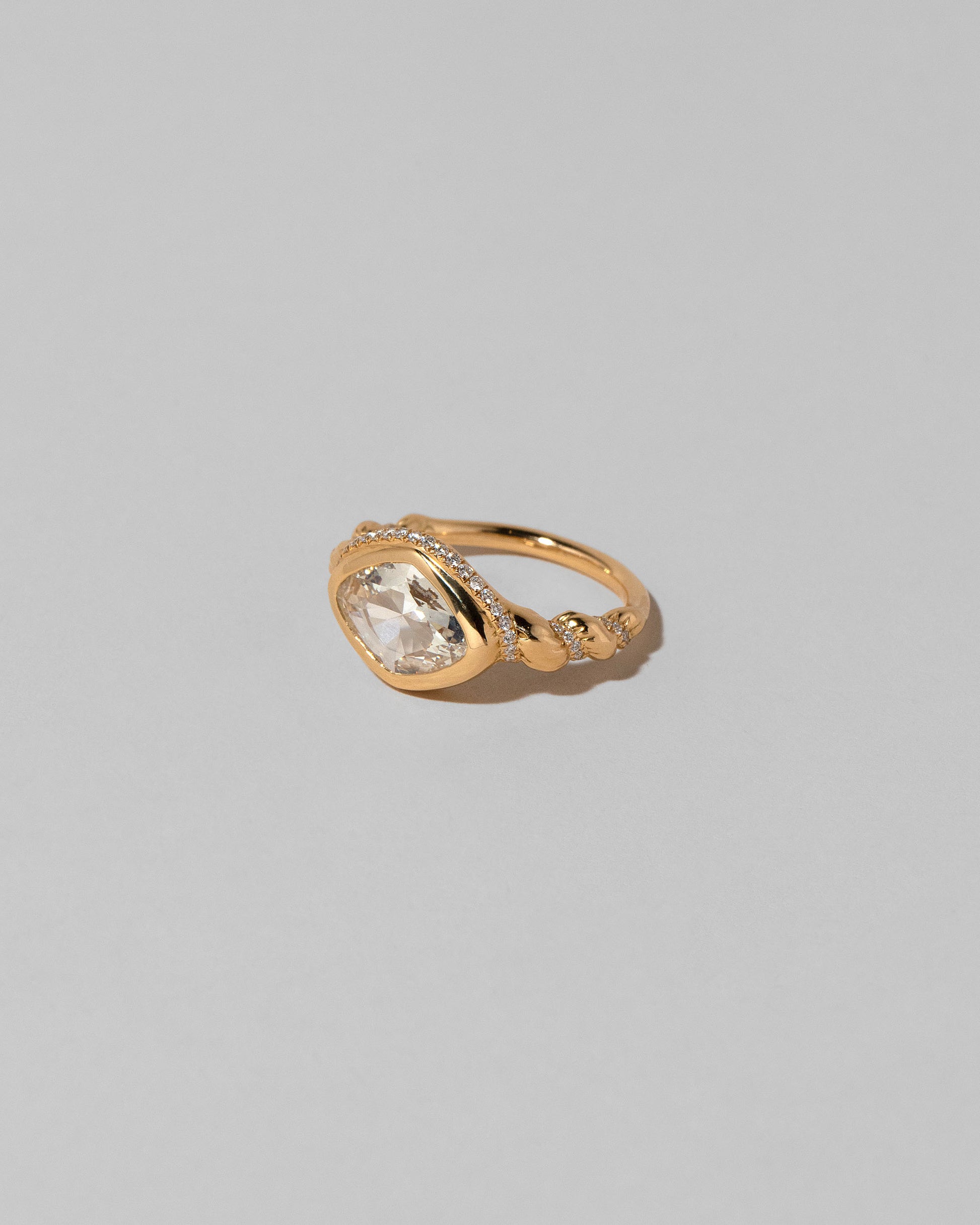 View from the side of the Twist Ring on light color background.