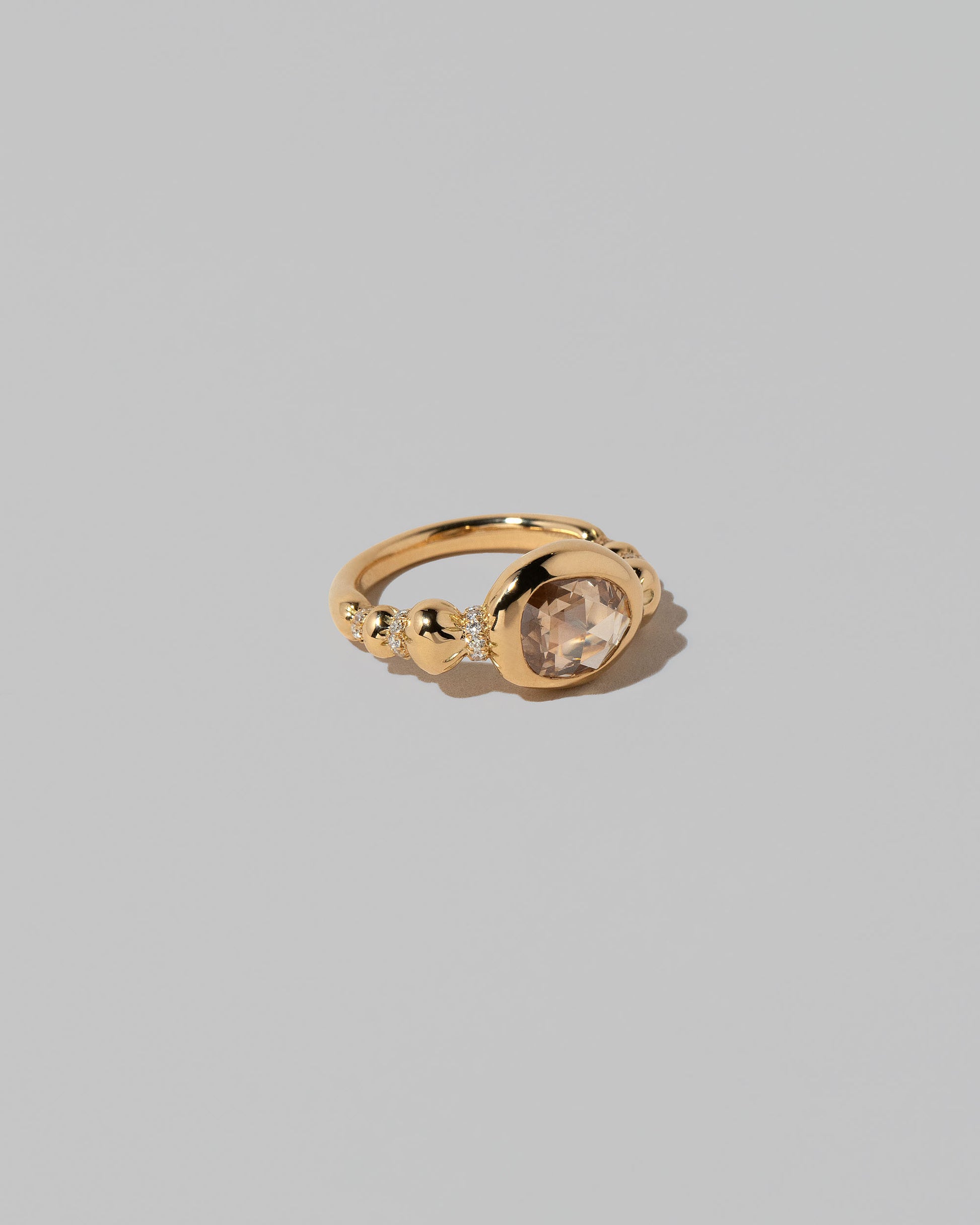 View from the side of the Wrapped Ring on light color background.