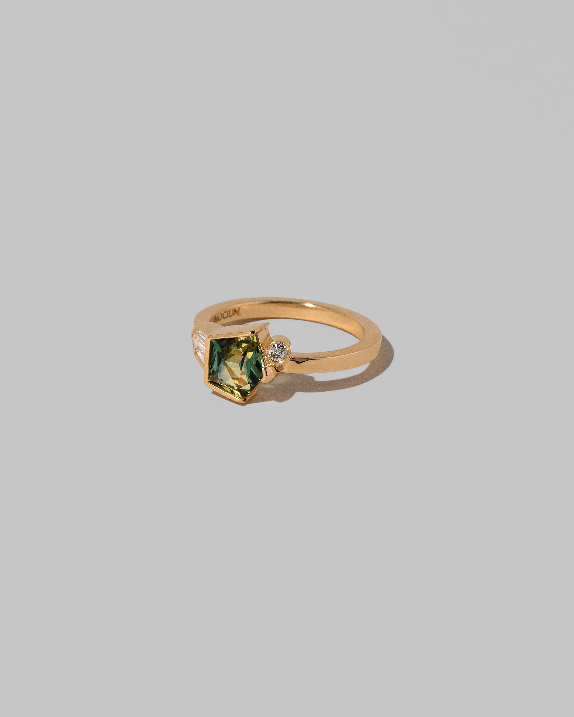 View from the side of the Ammi Ring on light color background.