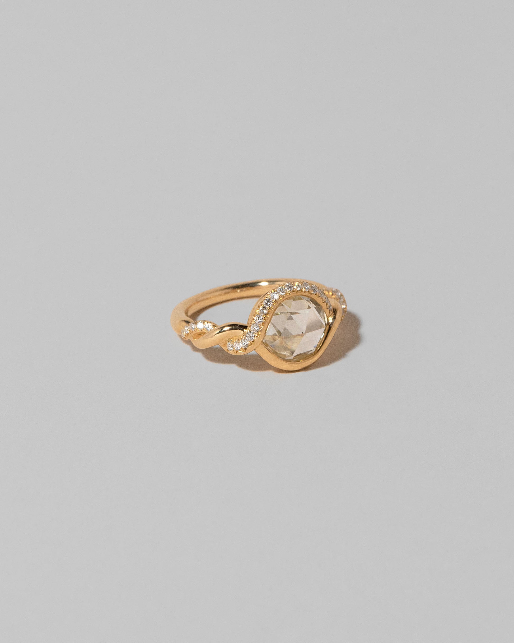 View from the side of the Entwine Ring on light color background.