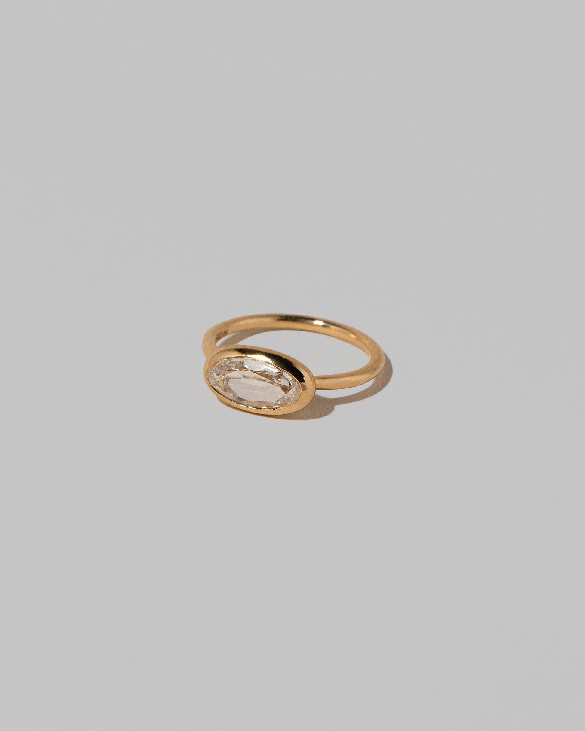 View from the side of the Gusher Diamond Ring 019 on light color background.