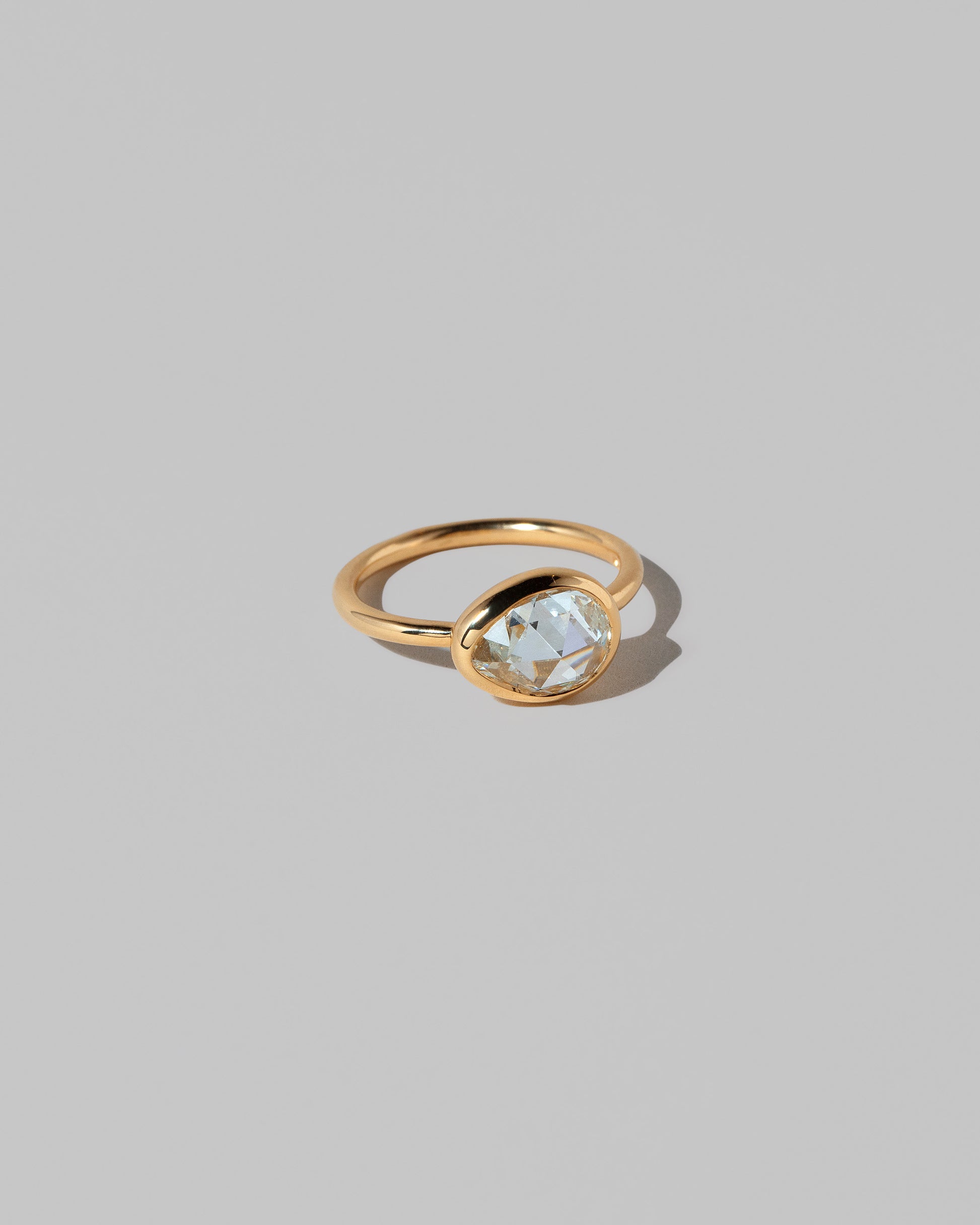 View from the side of the Gusher Diamond Ring 027 on light color background.