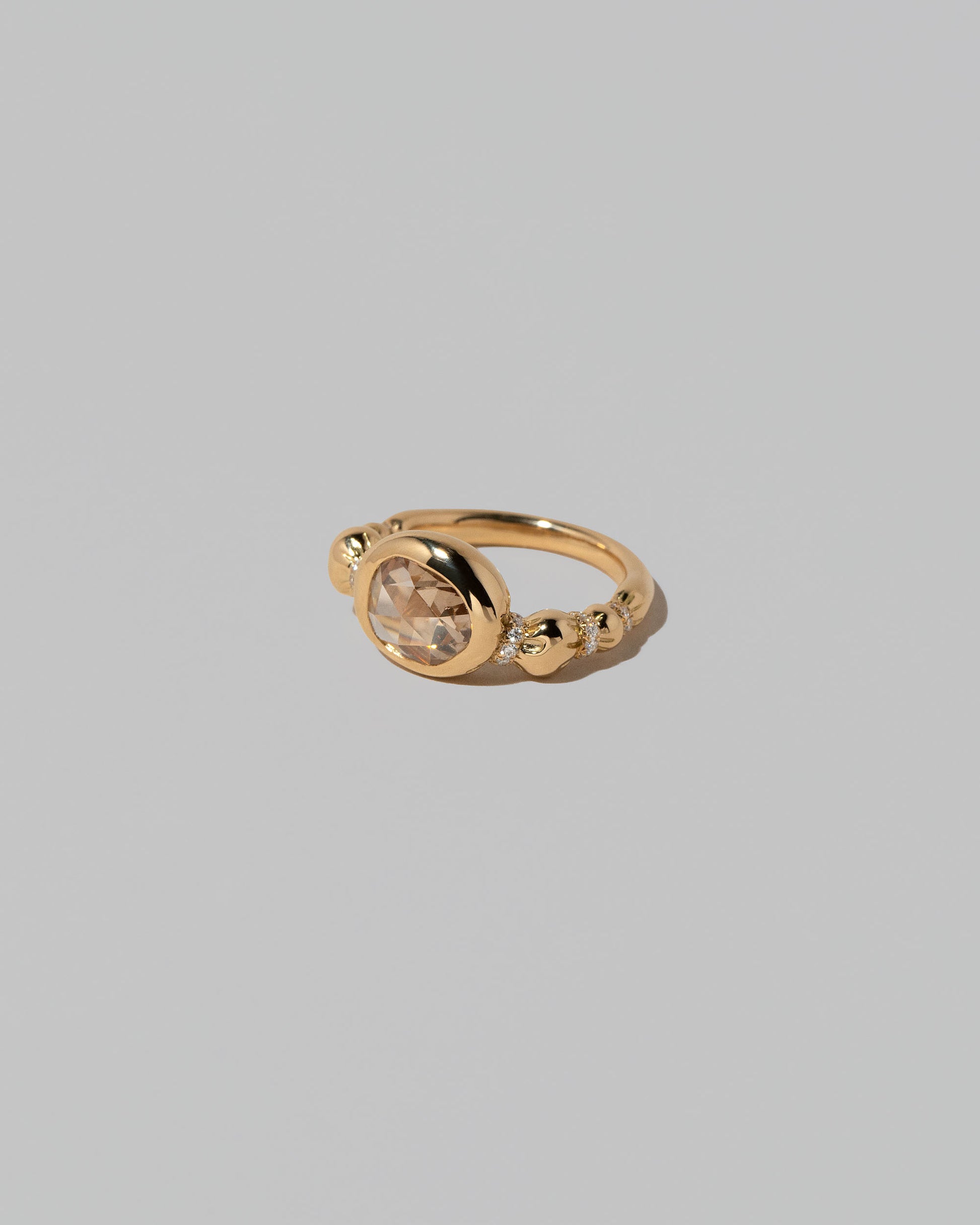View from the side of the Wrapped Ring on light color background.