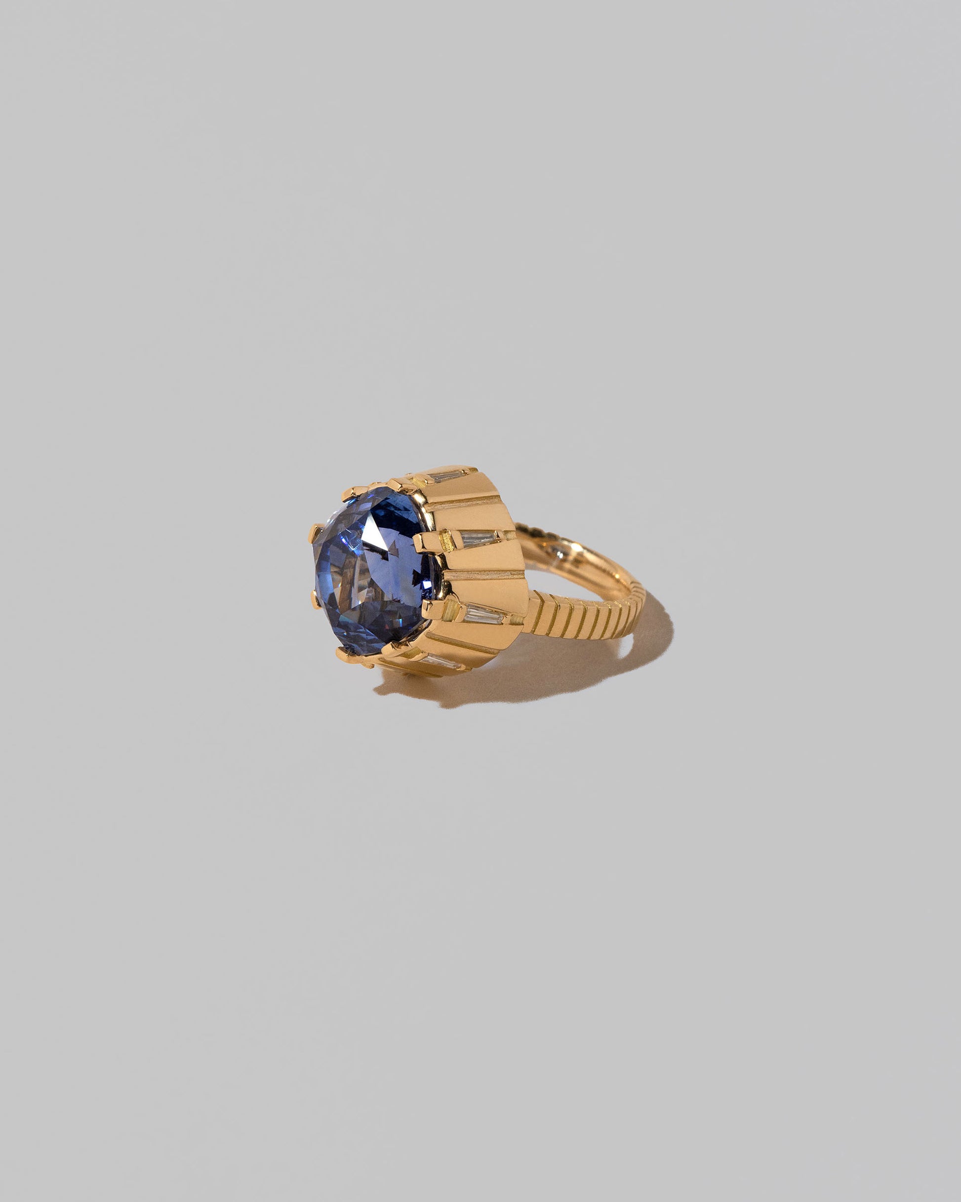 View from the side of the Alluim Ring on light color background.