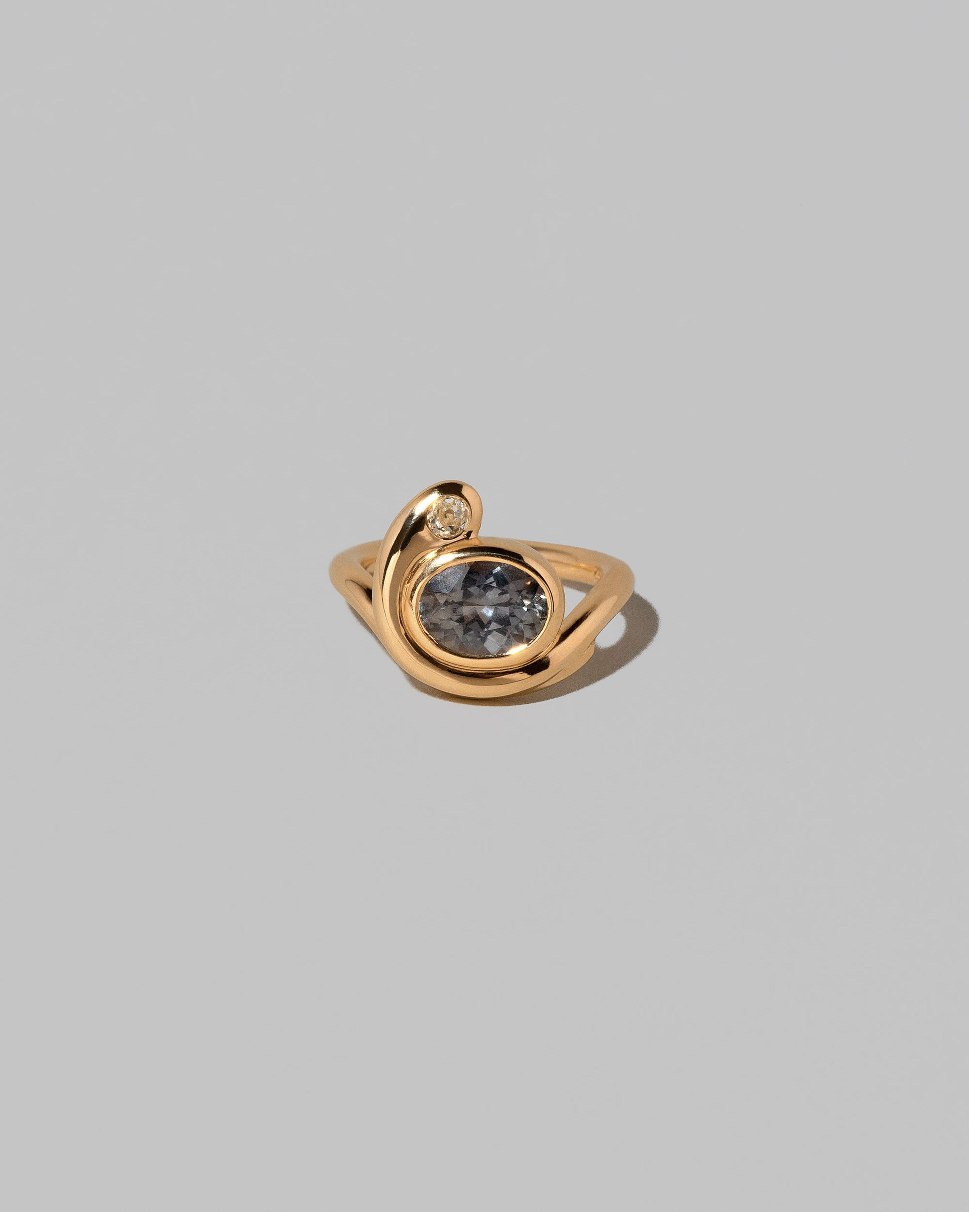 Ambrosina Ring on light color background.