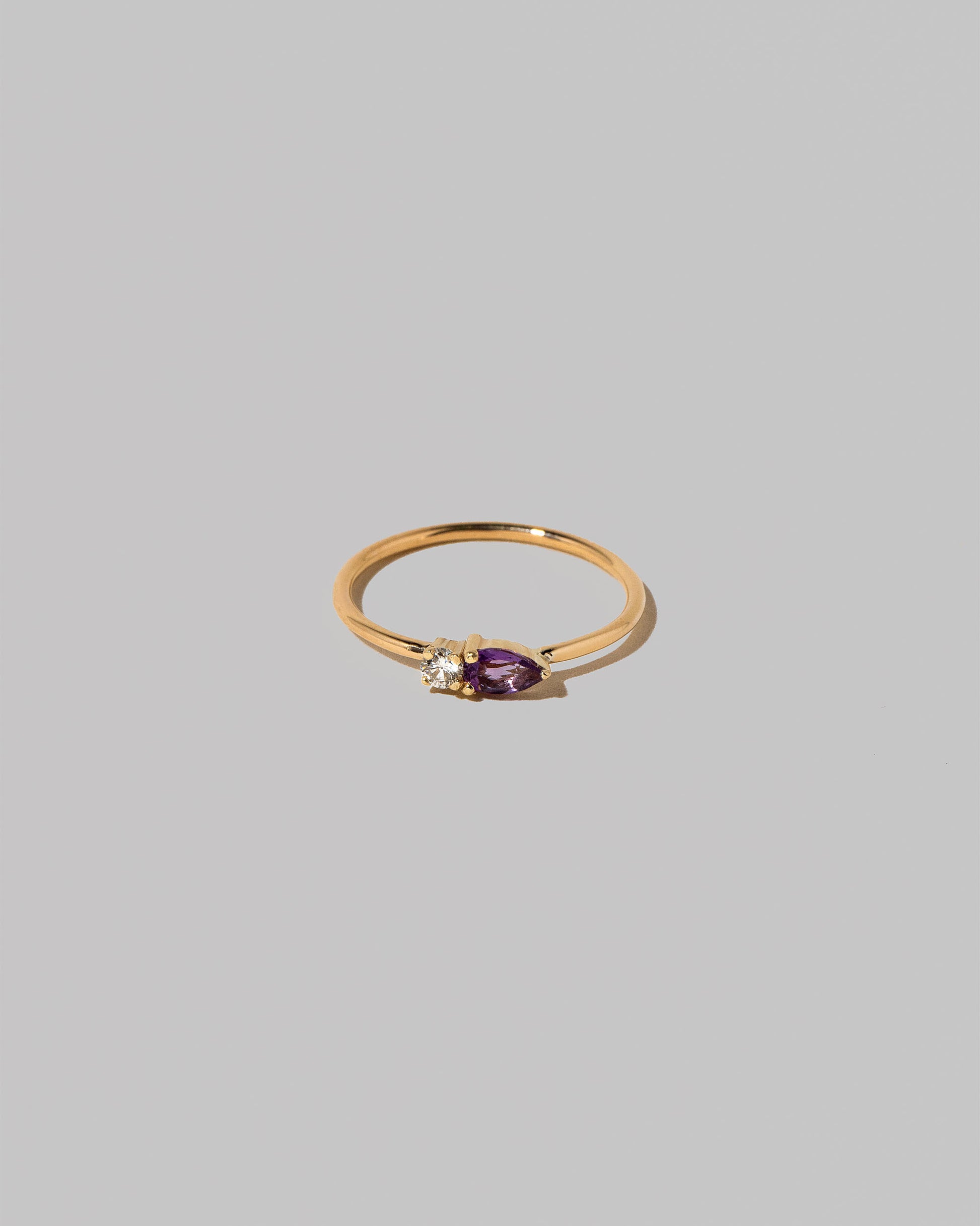 Amethyst Teardrops Ring on light color background.