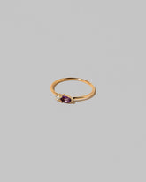 View from the side of the Amethyst Teardrops Ring on light color background.