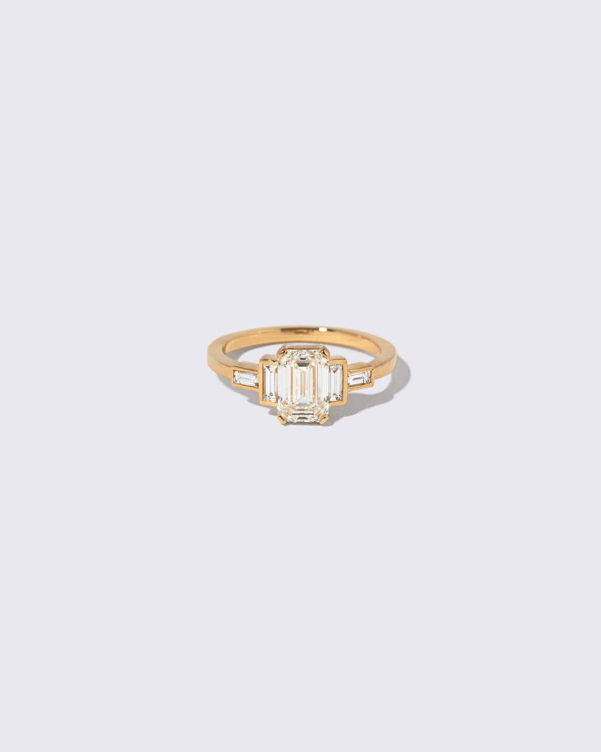 Diamond Assertion Ring on light color background.