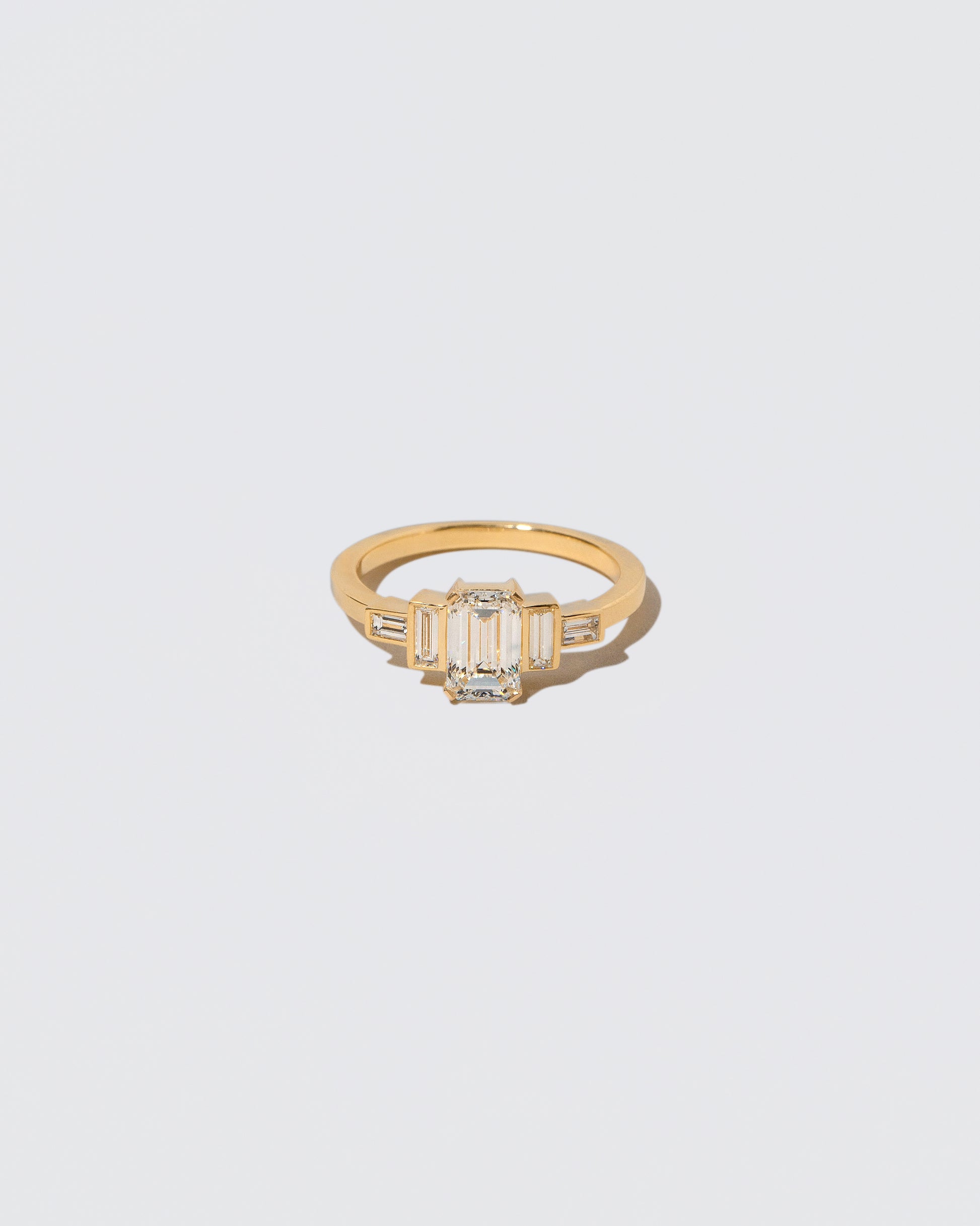 A past version of the Assertion Ring on light color background.