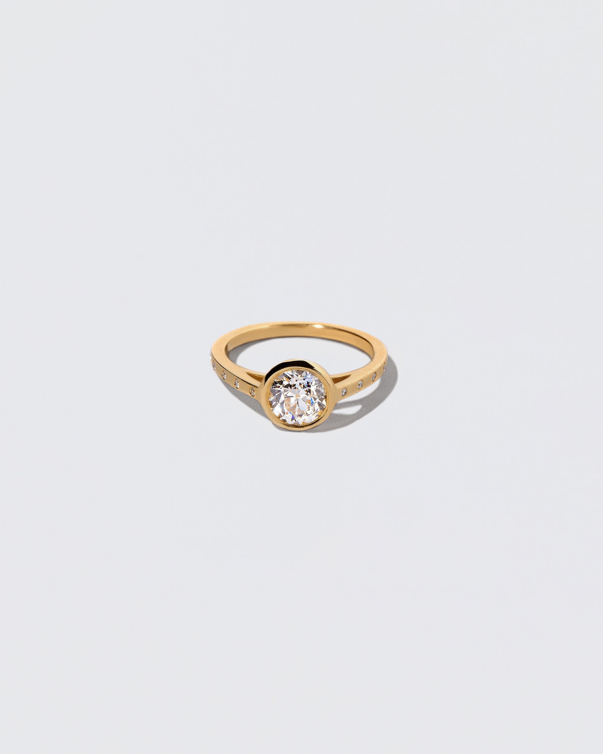 Diamond Calatrava Ring on light color background.