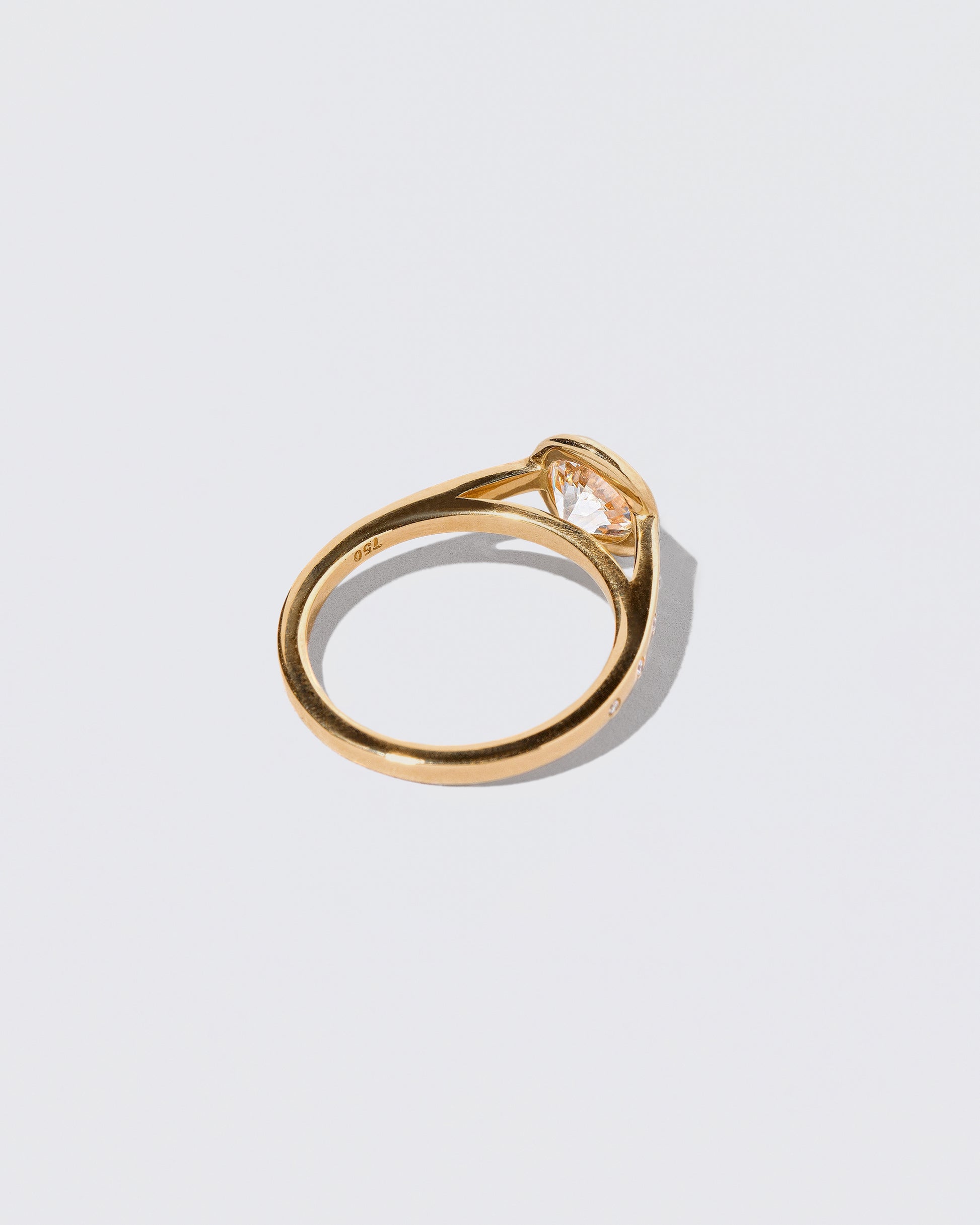 View from the back of the Diamond Calatrava Ring on light color background.