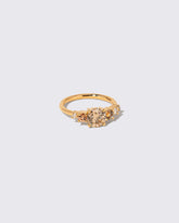 View from the side of the Champagne Diamond Capella Ring on light color background.