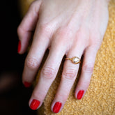 product_details::Champagne Diamond Grand Level Ring on model.