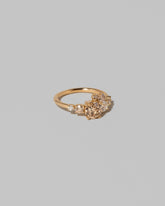 View from the side of the Champagne Diamond Luna Ring on light color background.