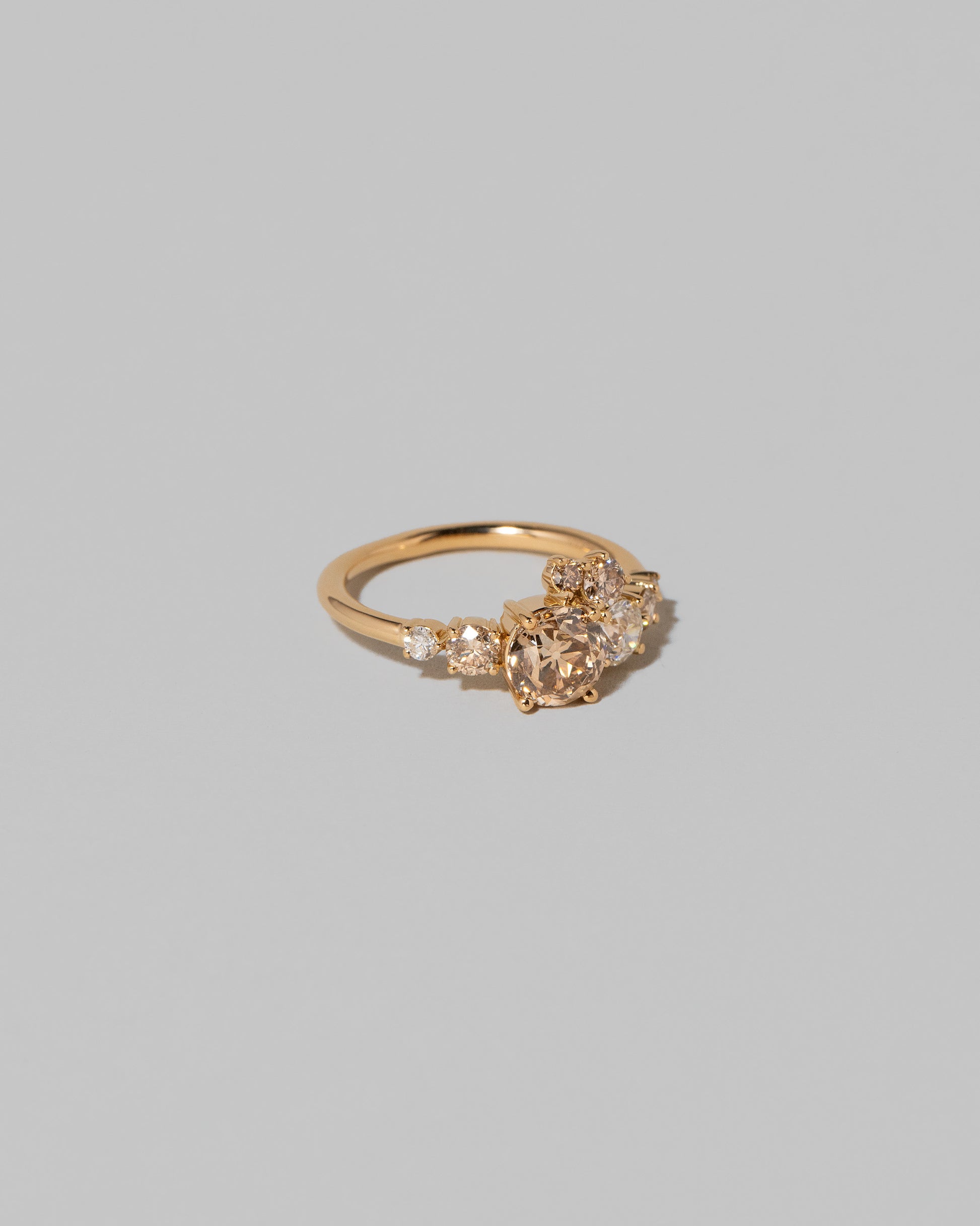 View from the side of the Champagne Diamond Luna Ring on light color background.