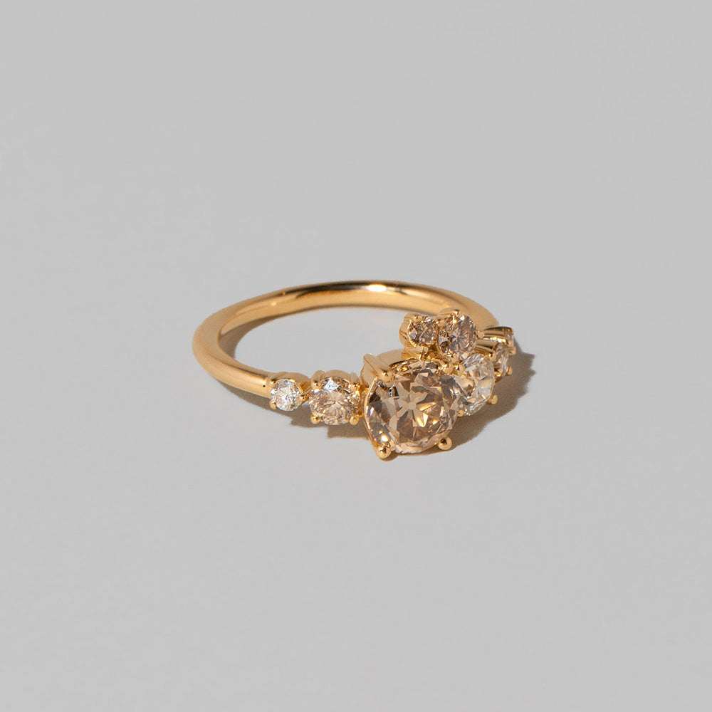 product_details::Champagne Diamond Luna Ring on light color background.