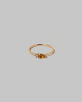 Citrine Teardrops Ring on light color background.