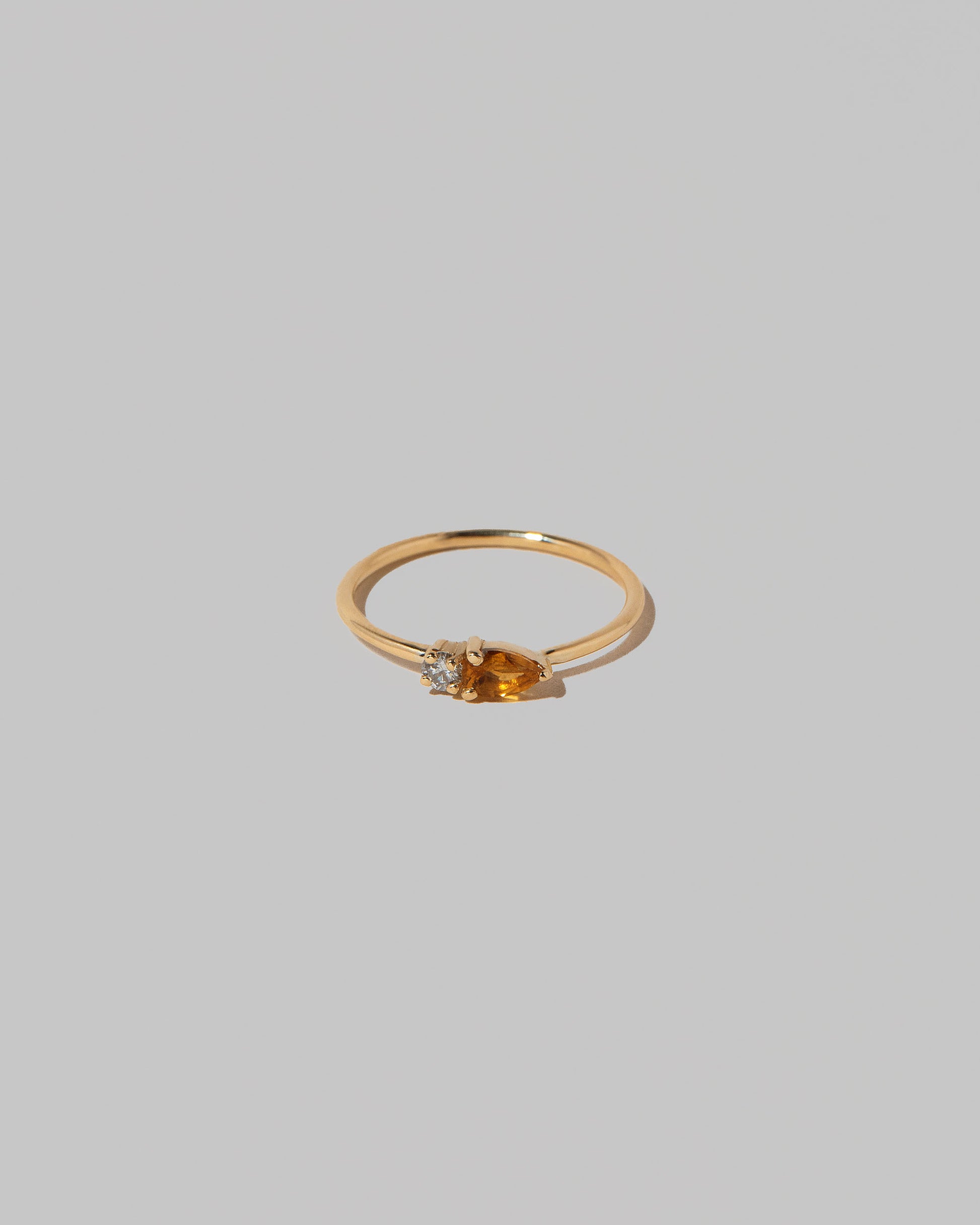 Citrine Teardrops Ring on light color background.