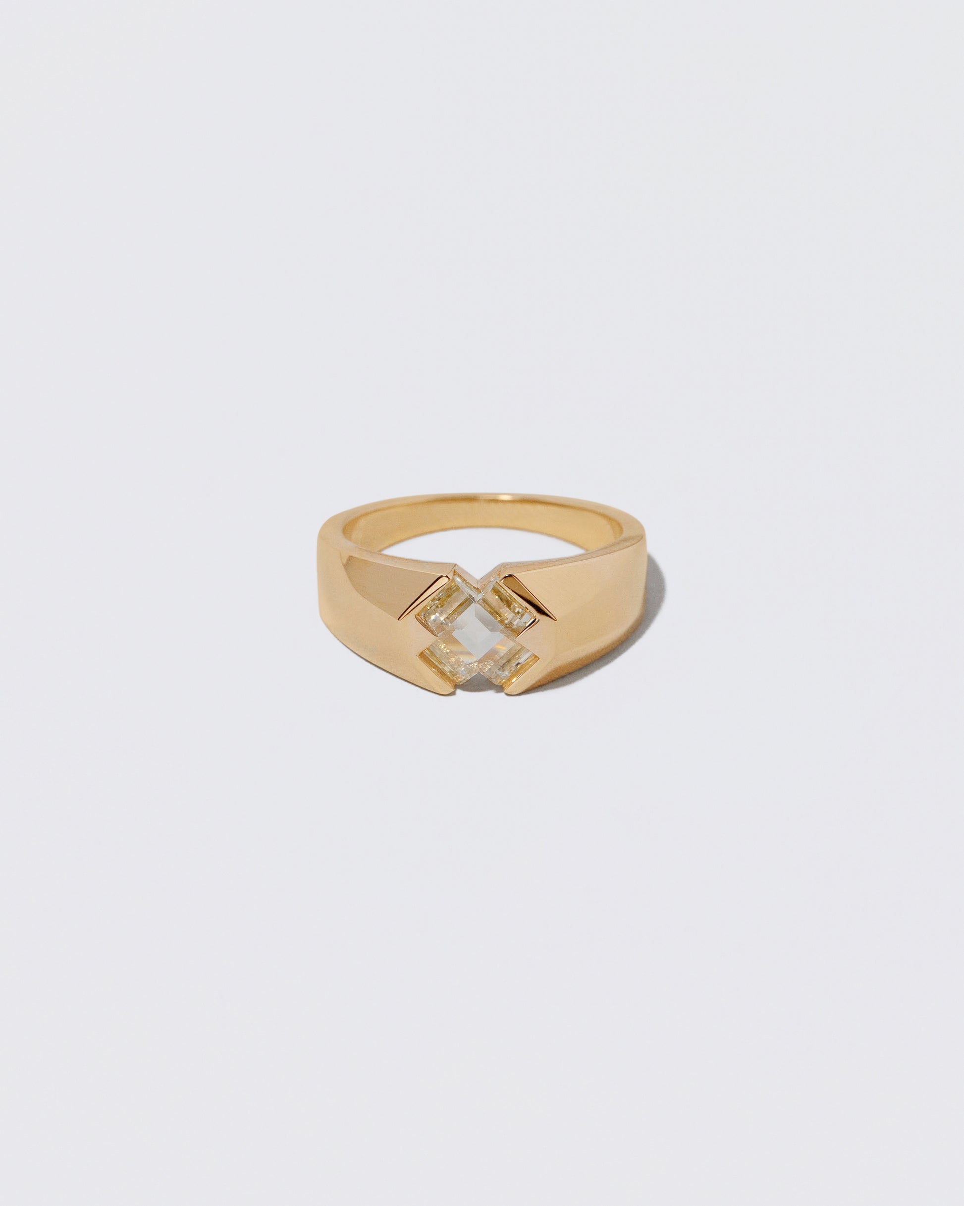 Compassion Ring on light color background.