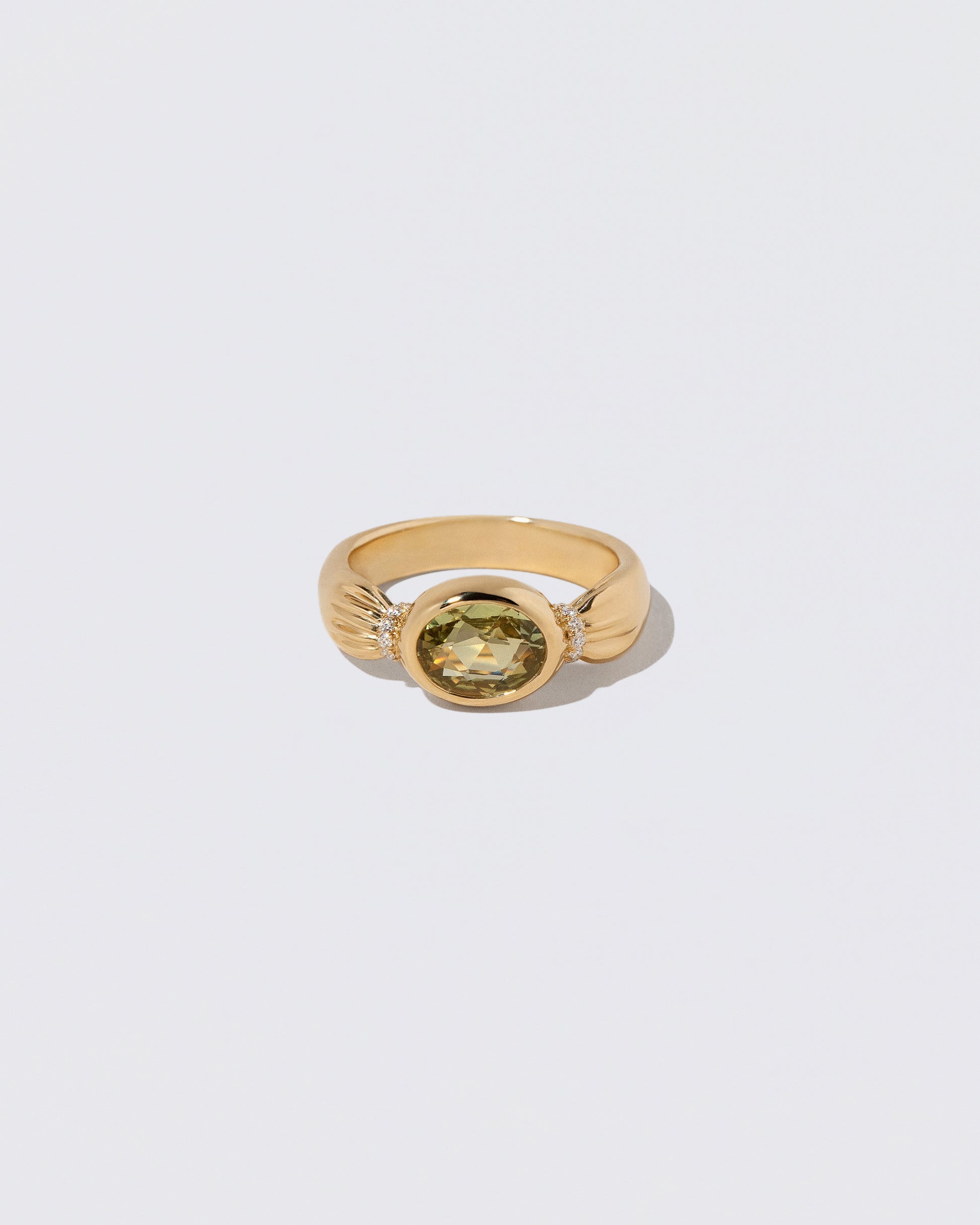 Sapphire Contort Ring on light color background.