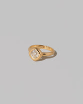View from the side of the Diamond Poise Ring on light color background.