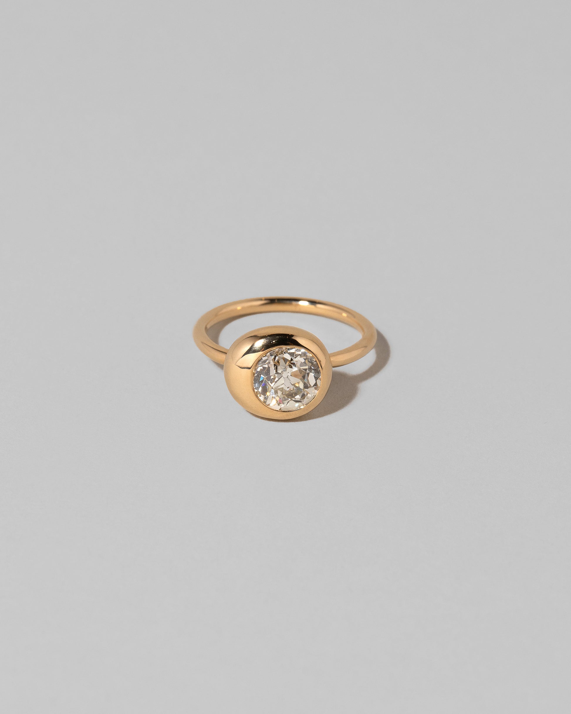 Diamond Grand Level Ring on light color background.