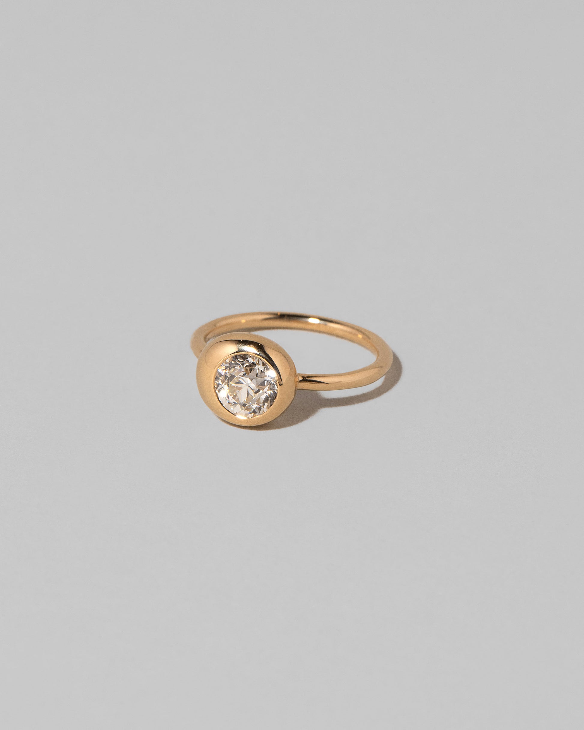 View of the Diamond Grand Level Ring on light color background.
