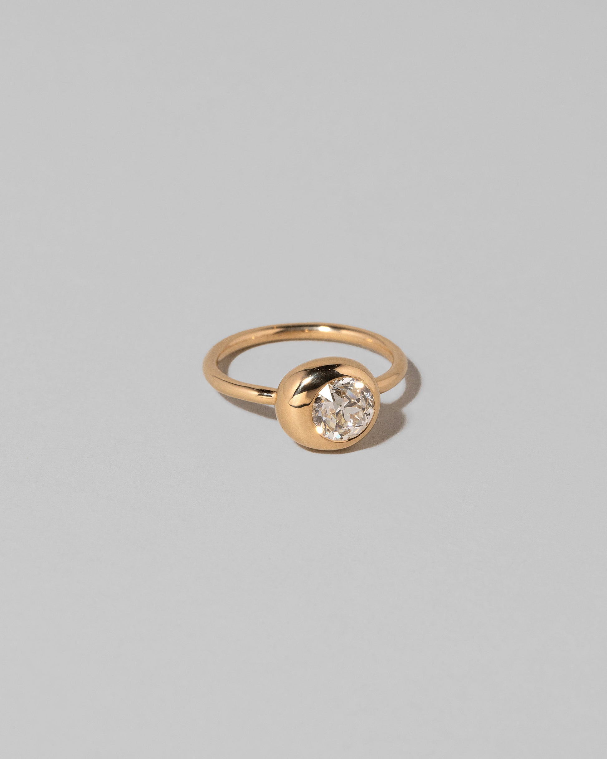 View of the Diamond Grand Level Ring on light color background.