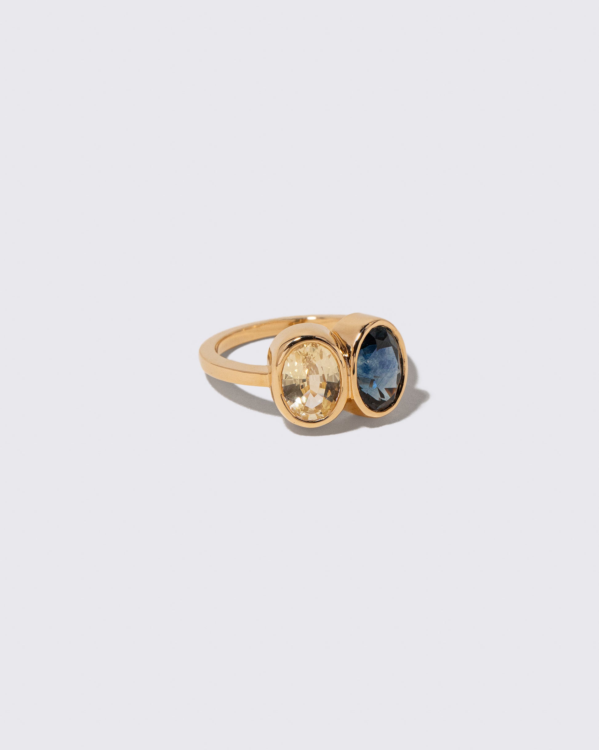 View from the side of the Double Drop Ring on light color background.