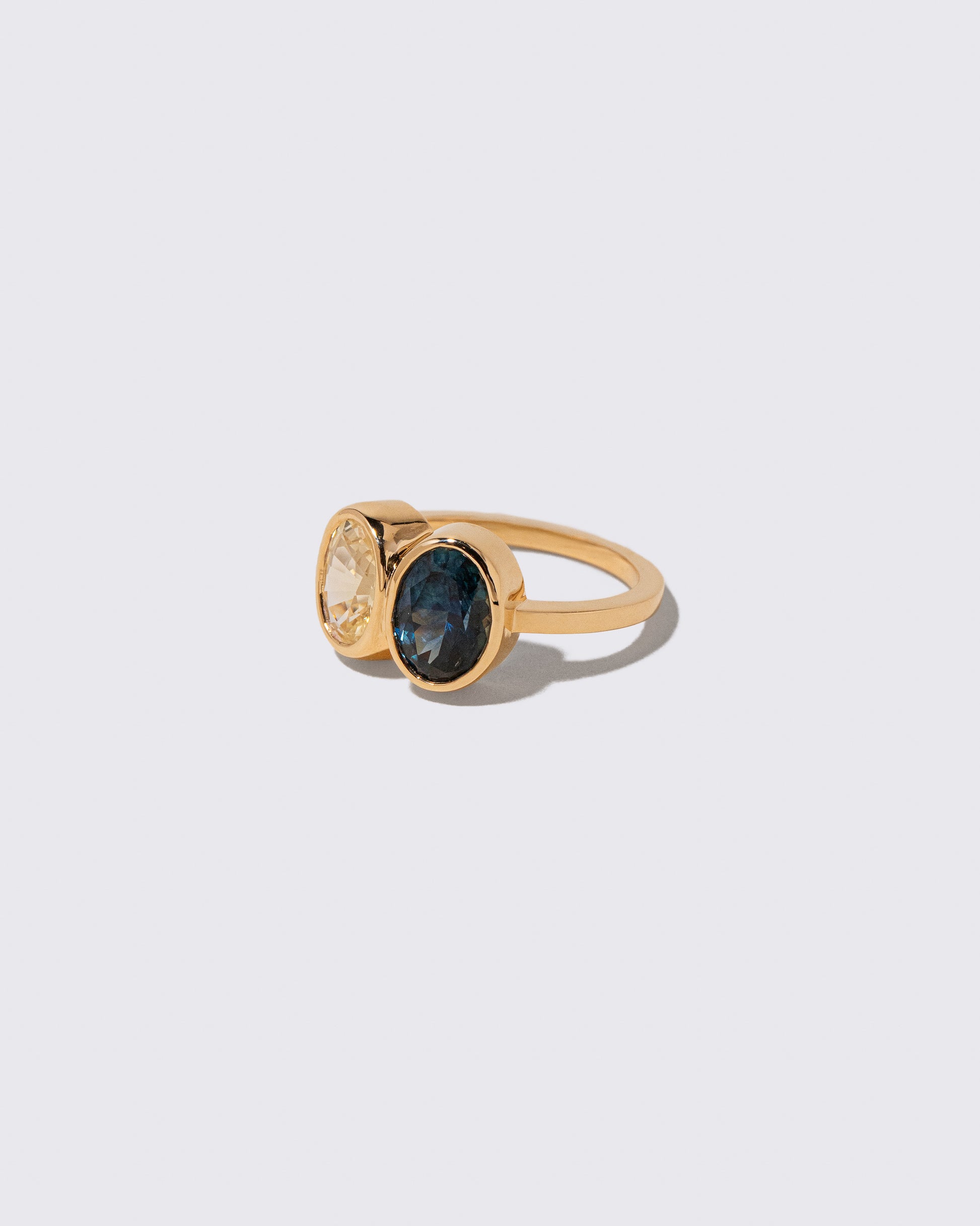 View from the side of the Double Drop Ring on light color background.